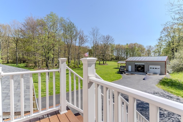 144 Crosstown Hwy, Union Dale, PA 18470 - wooden terrace with a lawn, a garage, an outdoor structure, and driveway