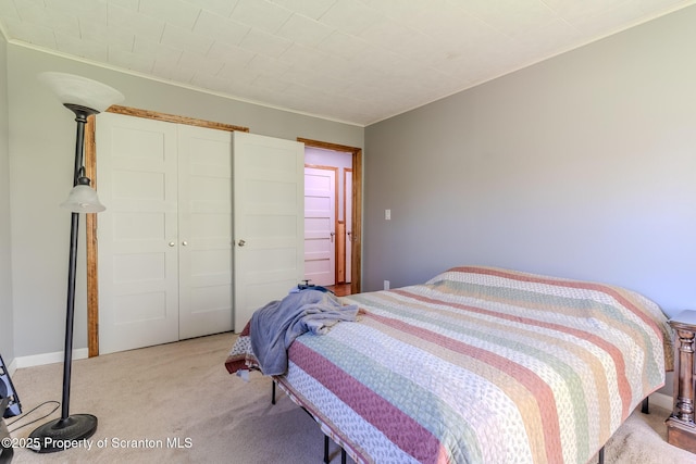 144 Crosstown Hwy, Union Dale, PA 18470 - bedroom featuring light colored carpet, a closet, and crown molding