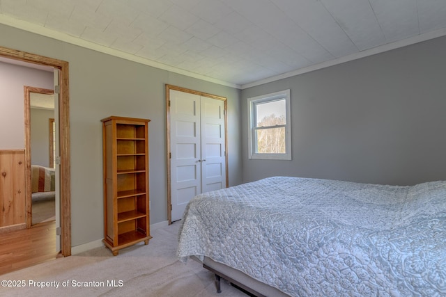 144 Crosstown Hwy, Union Dale, PA 18470 - bedroom featuring a closet, crown molding, and light colored carpet