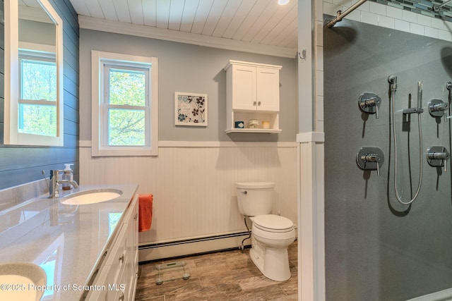 144 Crosstown Hwy, Union Dale, PA 18470 - full bath featuring baseboard heating, a shower stall, vanity, wainscoting, and wood finished floors