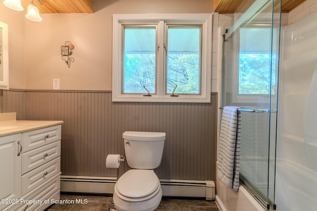 144 Crosstown Hwy, Union Dale, PA 18470 - full bath featuring a baseboard heating unit, baseboard heating, wainscoting, vanity, and combined bath / shower with glass door