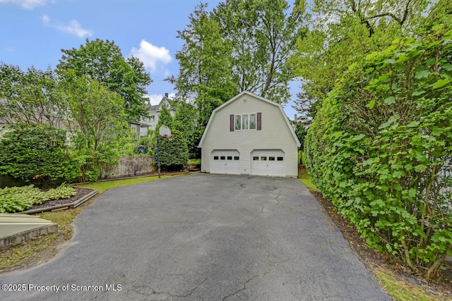 1120 Woodlawn St Unit L10, Scranton, PA 18509 - view of home's exterior featuring a detached garage, a gambrel roof, and an outdoor structure