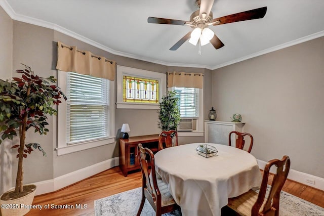 1120 Woodlawn St Unit L10, Scranton, PA 18509 - dining space with light wood-style flooring, baseboards, ornamental molding, a ceiling fan, and cooling unit