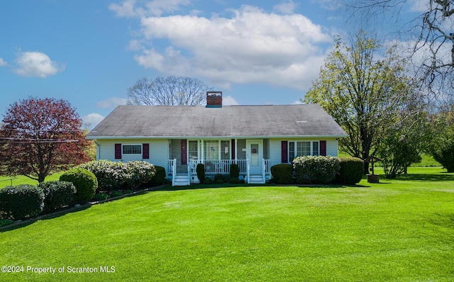 view of front of property with a porch and a front yard