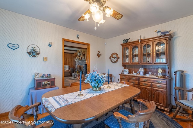 dining room featuring ceiling fan and wood-type flooring