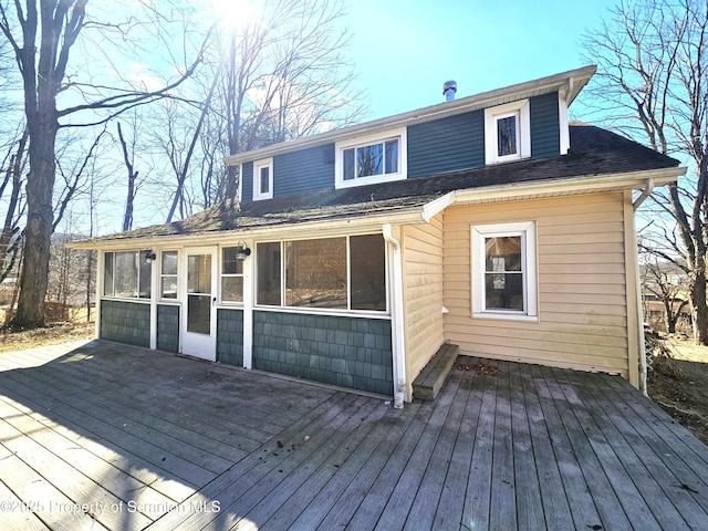 wooden terrace featuring a sunroom