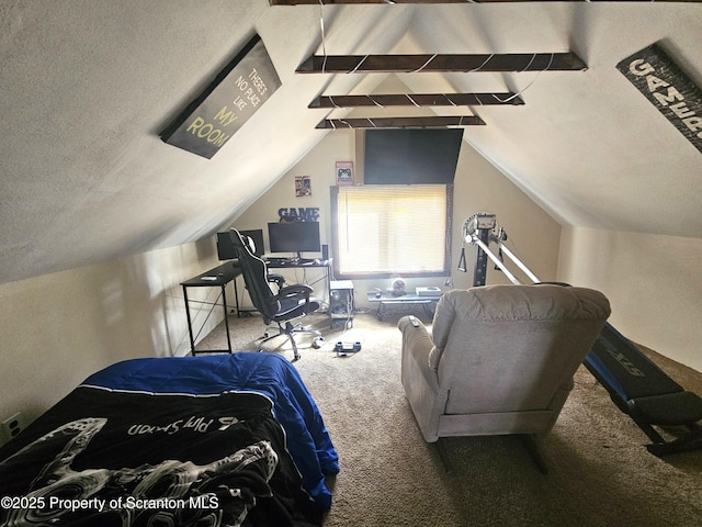 carpeted bedroom featuring lofted ceiling and a textured ceiling