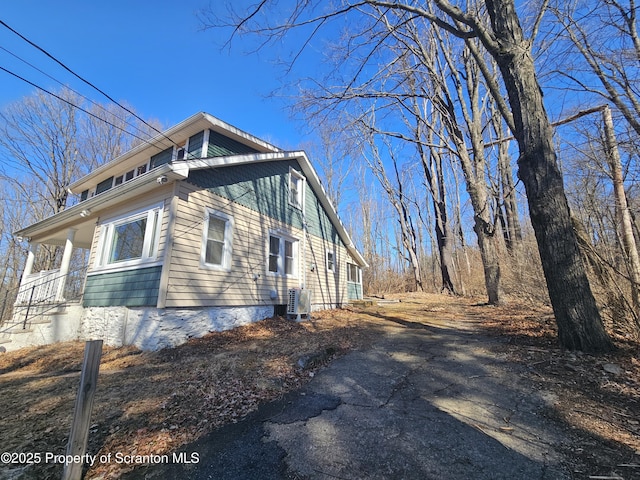 view of property exterior featuring central AC