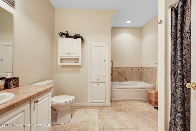 bathroom featuring tile patterned floors, vanity, a bathtub, and toilet