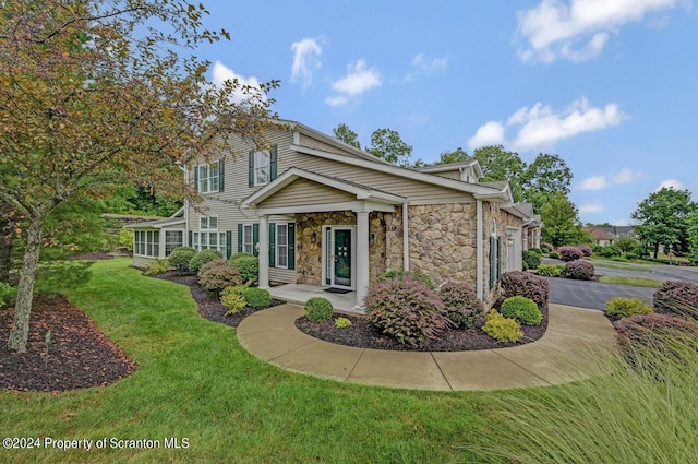 view of front of home with a front lawn