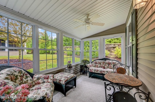 sunroom / solarium featuring ceiling fan and vaulted ceiling