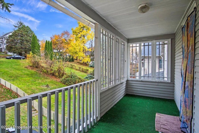 unfurnished sunroom with a wealth of natural light