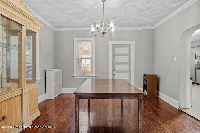 home office with ornamental molding, an inviting chandelier, and dark wood-type flooring