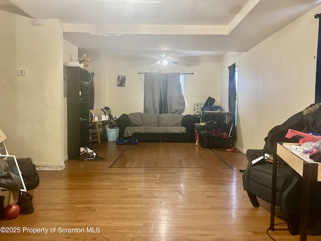 living room with baseboards and light wood-style floors