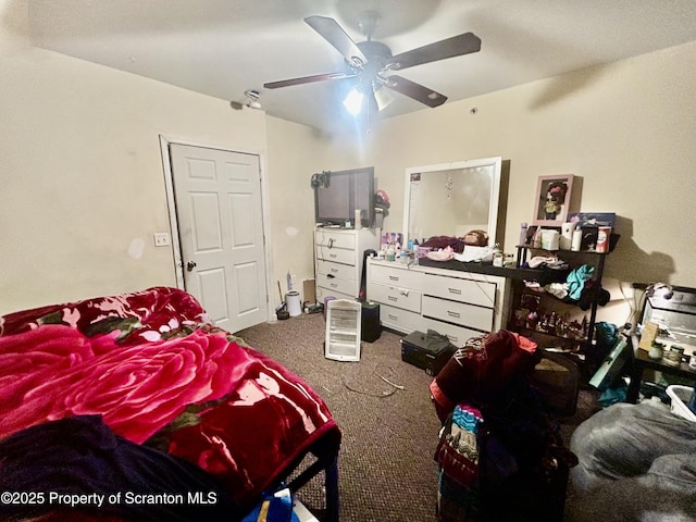 bedroom with a ceiling fan and carpet floors