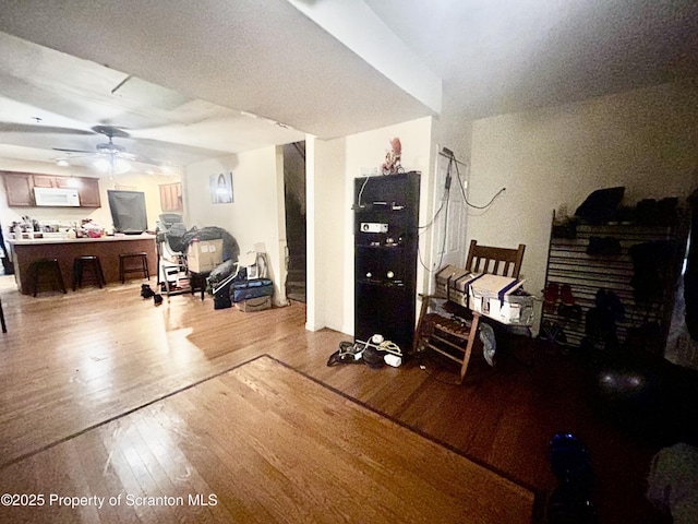 interior space featuring light wood-type flooring and ceiling fan