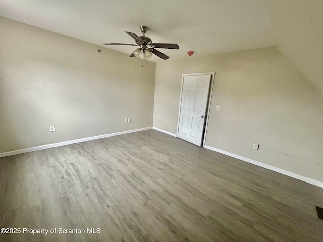 interior space with ceiling fan, baseboards, and wood finished floors