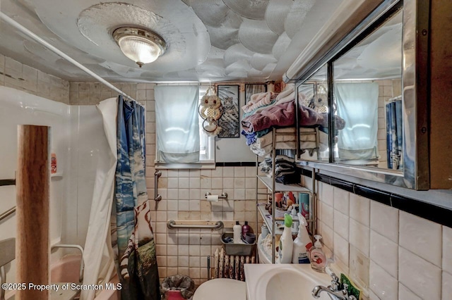 219 N Sumner Ave, Scranton, PA 18504 - bathroom featuring tile walls, toilet, and curtained shower
