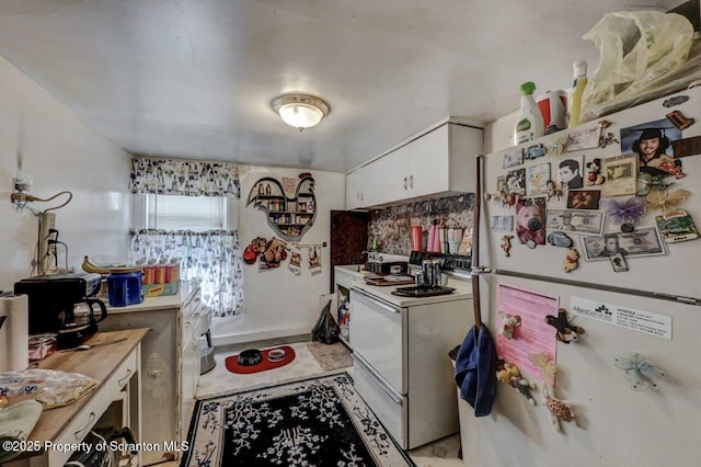 219 N Sumner Ave, Scranton, PA 18504 - kitchen featuring white appliances, white cabinets, and baseboards