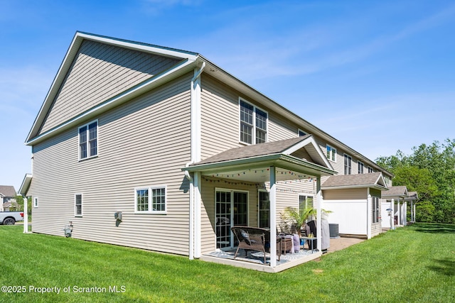 442 Shadow Wood Cir, Archbald, PA 18403 - back of property featuring a patio area and a lawn