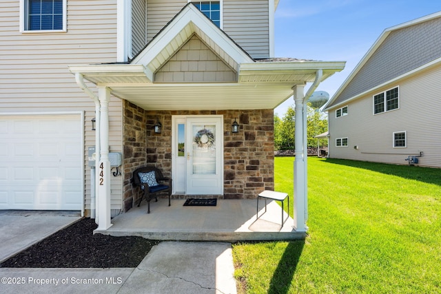 442 Shadow Wood Cir, Archbald, PA 18403 - entrance to property featuring a yard, stone siding, and a garage