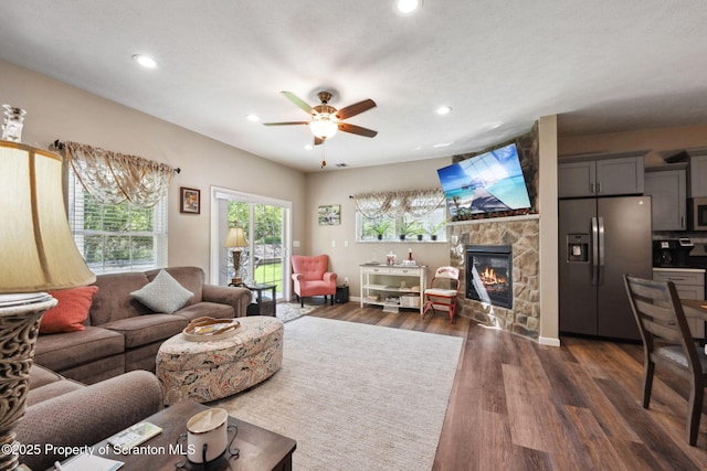 442 Shadow Wood Cir, Archbald, PA 18403 - living room with a ceiling fan, recessed lighting, a stone fireplace, and dark wood-type flooring