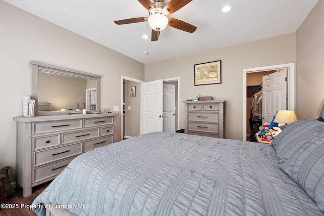 442 Shadow Wood Cir, Archbald, PA 18403 - bedroom featuring dark wood finished floors, recessed lighting, ceiling fan, and a walk in closet