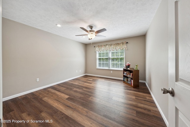 442 Shadow Wood Cir, Archbald, PA 18403 - spare room featuring dark wood-style floors, a ceiling fan, a textured ceiling, baseboards, and recessed lighting