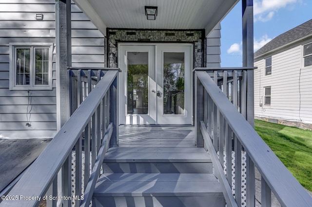 entrance to property featuring french doors