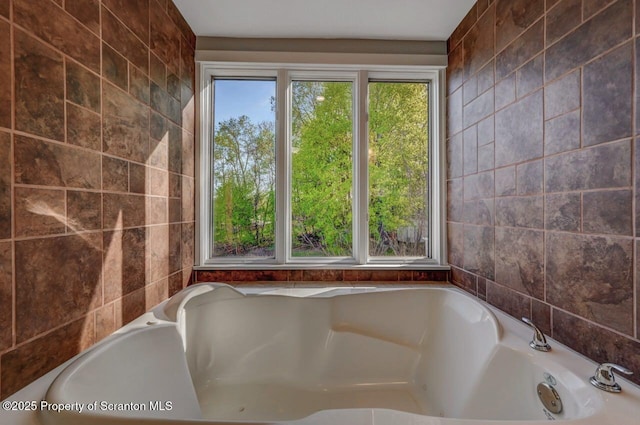 bathroom with tile walls and a washtub