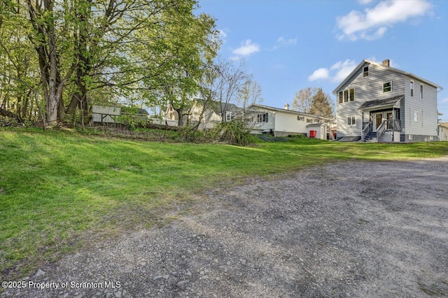 view of front of property with a front lawn and a chimney