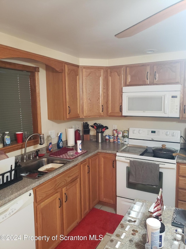 kitchen with white appliances and sink