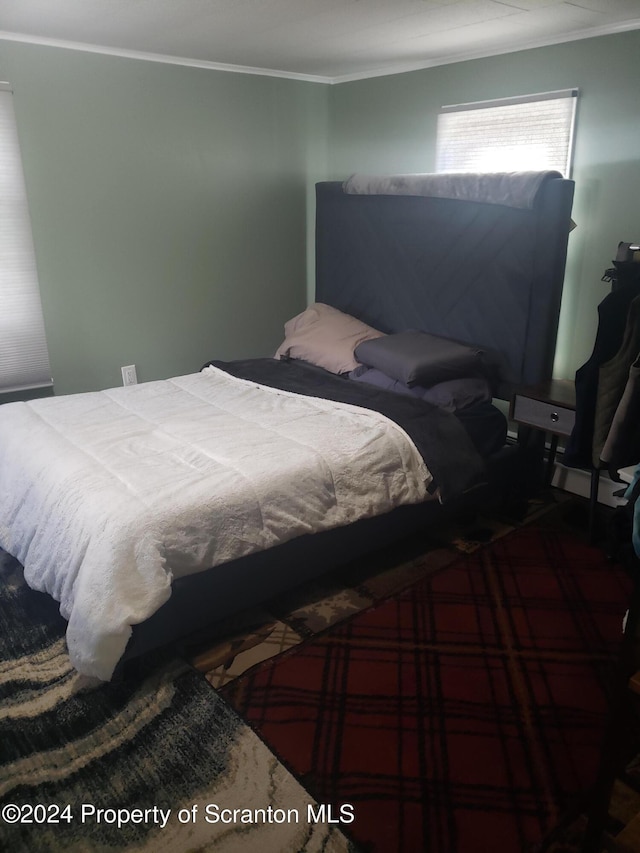 bedroom with crown molding