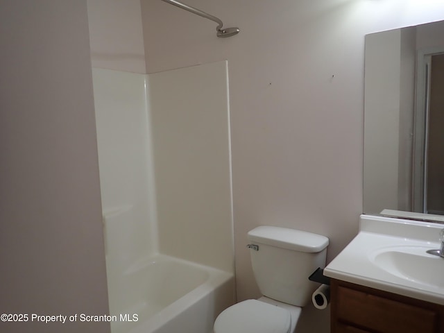 full bathroom with vanity, toilet, and washtub / shower combination