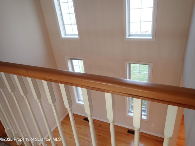 staircase with wood-type flooring