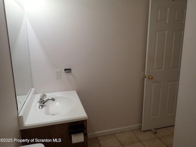 bathroom with tile patterned flooring and vanity