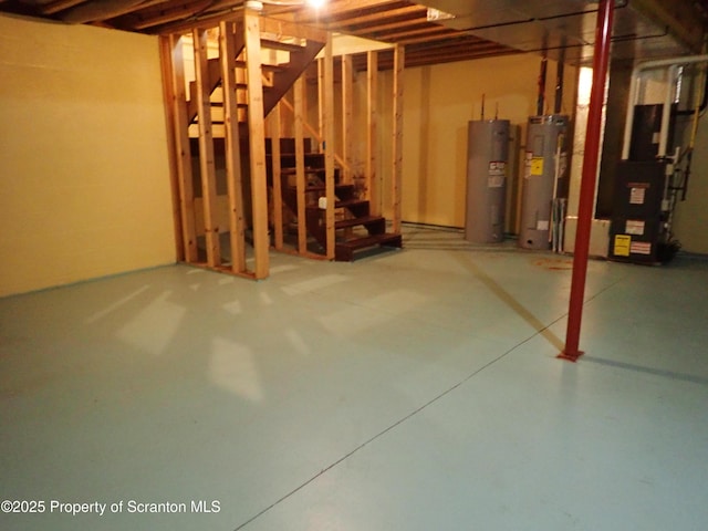 basement with electric water heater and water heater