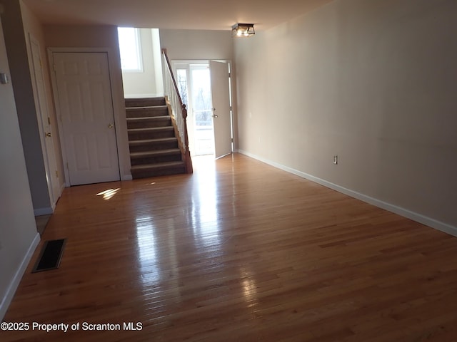 empty room with dark wood-type flooring