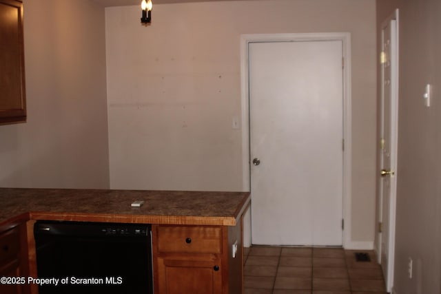 kitchen with tile patterned floors and black dishwasher