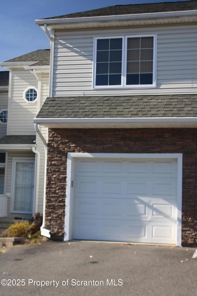 view of property exterior with a garage