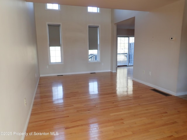 spare room featuring light wood-type flooring