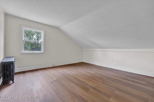 bonus room featuring hardwood / wood-style floors and vaulted ceiling