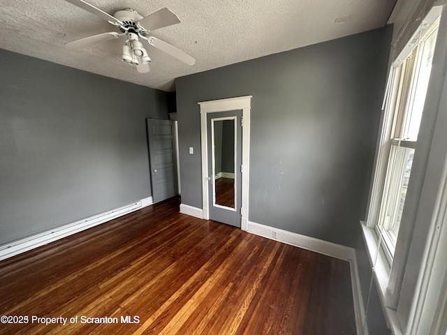 1518 Vine St, Scranton, PA 18510 - unfurnished bedroom featuring baseboards, wood finished floors, a textured ceiling, and a ceiling fan