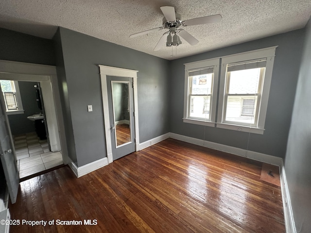 1518 Vine St, Scranton, PA 18510 - unfurnished room with hardwood / wood-style floors, a textured ceiling, baseboards, and a ceiling fan
