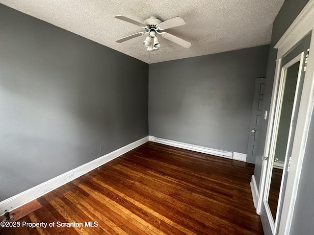 1518 Vine St, Scranton, PA 18510 - empty room with a baseboard heating unit, dark wood finished floors, baseboards, a textured ceiling, and a ceiling fan
