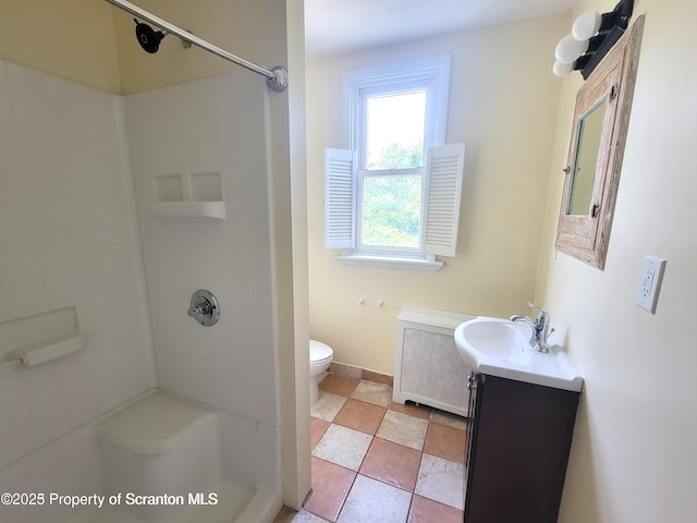 1518 Vine St, Scranton, PA 18510 - bathroom featuring vanity, toilet, a shower, and baseboards