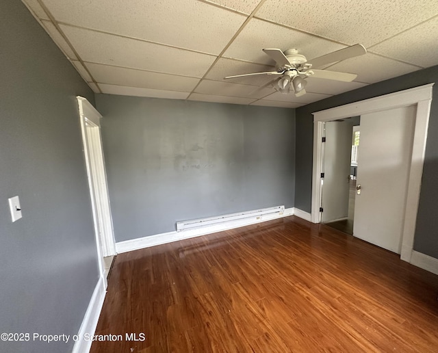 1518 Vine St, Scranton, PA 18510 - empty room featuring a baseboard radiator, a paneled ceiling, ceiling fan, wood finished floors, and baseboards