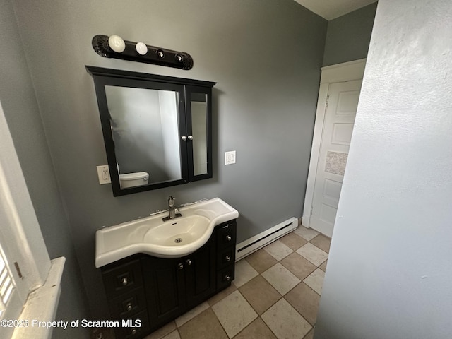 1518 Vine St, Scranton, PA 18510 - bathroom featuring baseboard heating and vanity