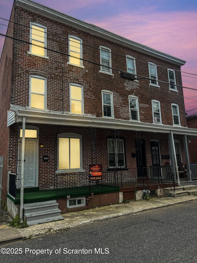 1132 Chestnut St, Allentown, PA 18109 - townhome / multi-family property featuring brick siding and a porch