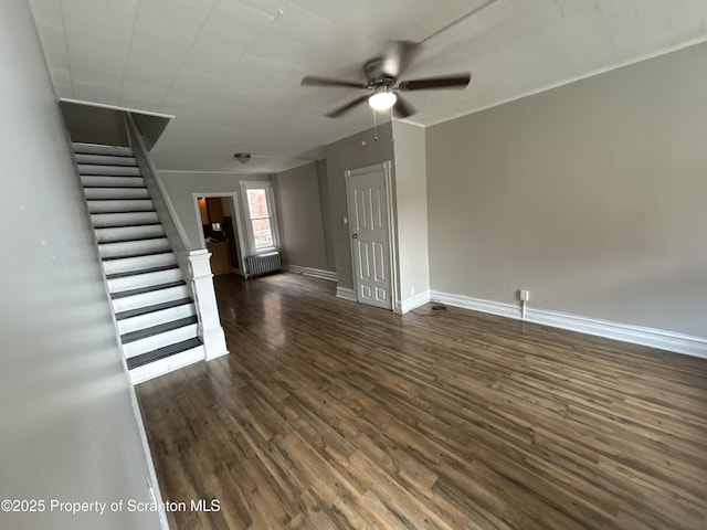 1132 Chestnut St, Allentown, PA 18109 - unfurnished living room featuring dark wood finished floors, a ceiling fan, stairs, and radiator